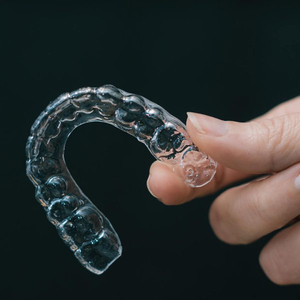 hand-holding-transparent-retainer-2023-01-09-22-38-26-utc (1)