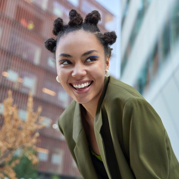 outdoor-shot-of-happy-teenage-girl-with-bun-hairst-2022-11-19-02-48-38-utc (1)