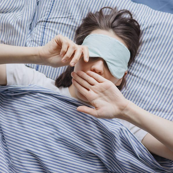 top-view-of-a-woman-in-bed-wearing-a-sleep-mask-a-2022-11-17-10-05-08-utc (1)